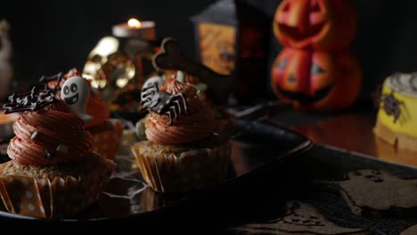 Fancy-Halloween-food-Party-Table-with-Pumpkin-Cupcake-Muffin-and-cookies.