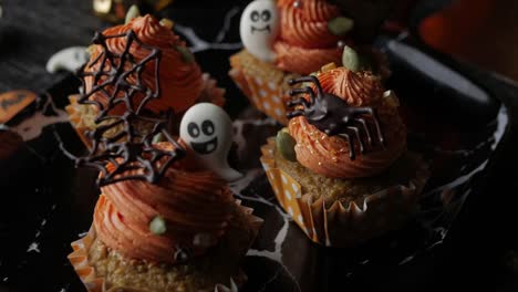 Fancy-Halloween-food-Party-Table-with-Pumpkin-Cupcake-Muffin-and-cookies.