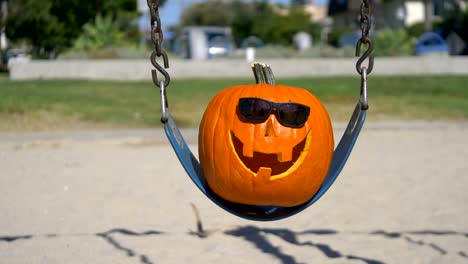 Happy-Halloween-pumpkin-on-the-swing-in-4K-Slow-motion-60fps