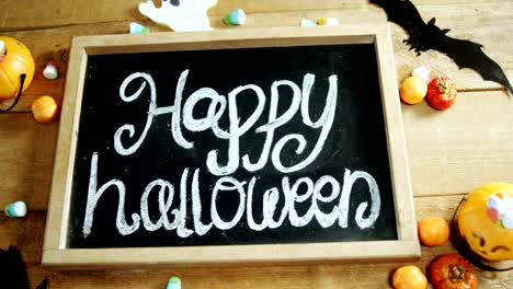 Happy-halloween-text-written-on-a-slate-4k