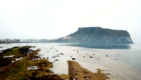 Aerial-view-Sunrise-at-Seongsan-Ilchulbong,-Jeju-Island,-South-Korea