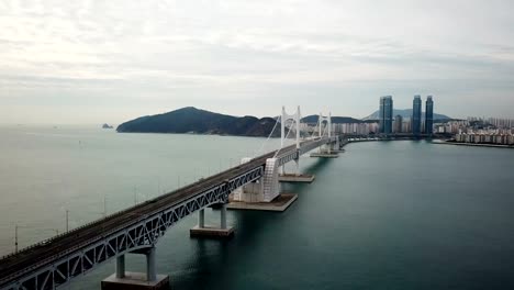 Gwangan-Bridge-and-Haeundae-aerial-view-at-Sunrise,-Busan,-South-Korea.