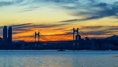 Timelapse-of-Gwangan-Bridge-and-Haeundae-at-Sunset,-Busan-City,-South-Korea.Timelapse-4k