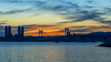 Timelapse-of-Gwangan-Bridge-and-Haeundae-at-Sunset,-Busan-City,-South-Korea.Timelapse-4k