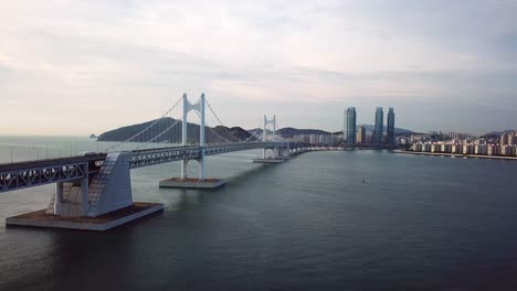 Gwangan-Bridge-and-Haeundae-aerial-view-at-Sunrise,-Busan,-South-Korea.