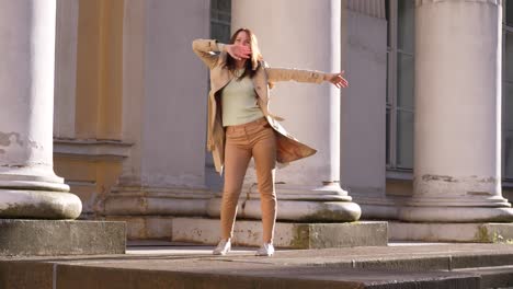 Businesswoman-Funky-Dancing-near-historic-palace