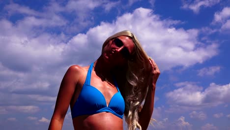 Blonde-girl-with-long-hair--against-the-sea