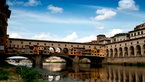 Florence-in-Italy.-Ponte-Vecchio-on-a-sunny-day.-The-famous-medieval-bridge-over-the-Arno-river,-in-Florence,-Italy.-Timelapse-4K-UHD-Video.-Nikon-D300