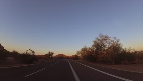 Drive-through-dramatic-Arizona-Papago-Park-Buttes-towards-Phoenix.