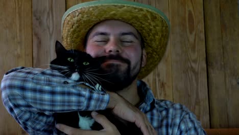 The-unshaven-man-lying-with-a-cat