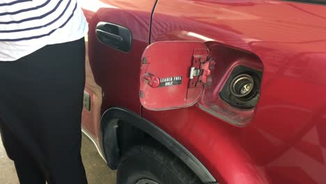 Woman-Fulling-a-car-in-a-Gas-Station