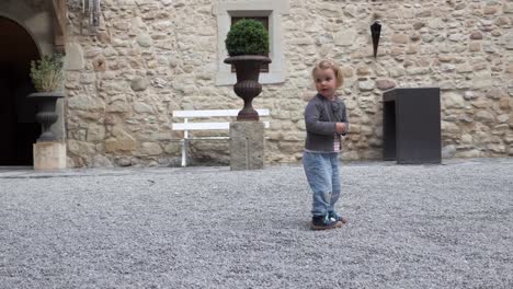 Toddler-Running-in-Medieval-Castle-Inner-Courtyard