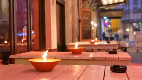 Oil-lamps-burning-outdoor-at-night-in-Brussels---Medium-shot