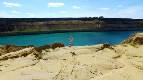 Aerial:-girl-found-a-lake-in-the-desert