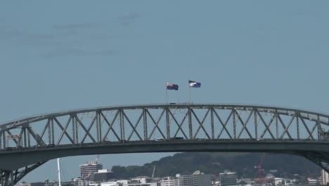 New-Zealand-National-flag-and-the-Silver-Fern-flag-on-Auckland-Harbour-Bridge