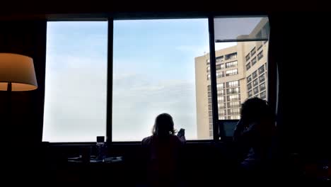 Mother-and-Daughter-by-the-Window-Rear-View-Silhouettes-2