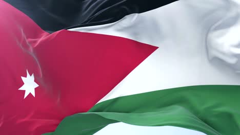 Flag-of-Jordan-waving-at-wind-with-blue-sky-in-slow,-loop