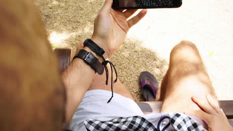 Personal-Perspective-of-a-Man-Sitting-in-a-Bench