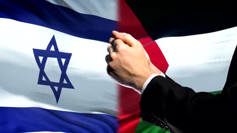 Israel-Palestina,-brazos-encadenados,-conflicto-político-o-económico,-prohibición-de-sanciones