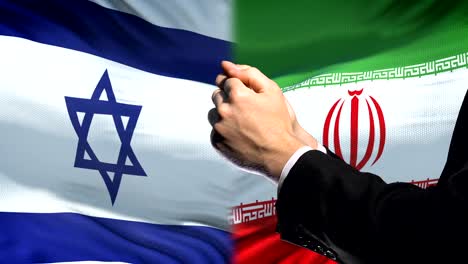 Israel-Sanktionen-Iran,-verkettete-Arme,-politischen-oder-wirtschaftlichen-Konflikt-Handel-Verbot