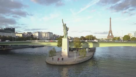 Statue-of-Liberty-and-Eiffel-Tower-in-Paris-in-drone-aerial-footage