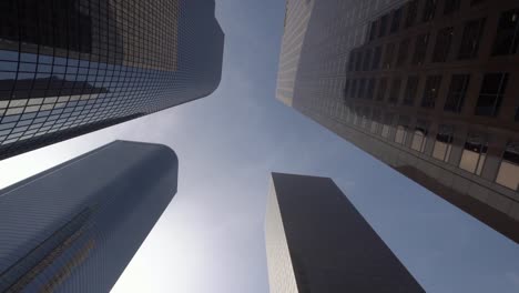 Looking-up-glide-shot-view-of-modern-business-skyscrapers-in-Los-Angeles-city-financial-district