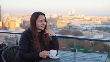 lady-drinking-coffee-at-outdoor-cafe-with-amazing-view-in-barcelona