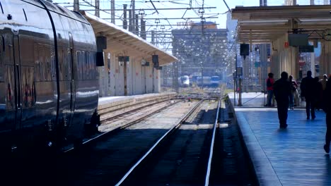 At-the-rail-station-the-train-has-just-left-and-passengers-leave-the-platform