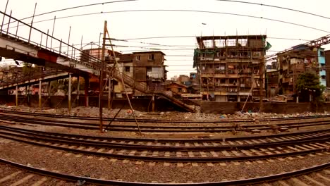 local-railway-lines-view-from-moved-train-on-poor-district-of-Mumbai