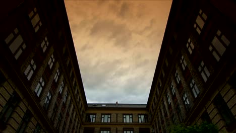 Clouds-passing-over-courtyard,-Vesterbro,-Copenhagen