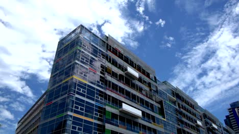 Sky-moving-on-coloured-building