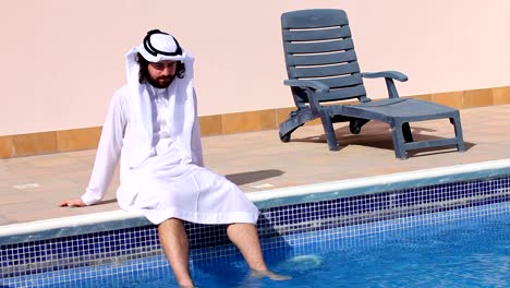 Saudi-arabian-man-enjoying-at-swimming-pool