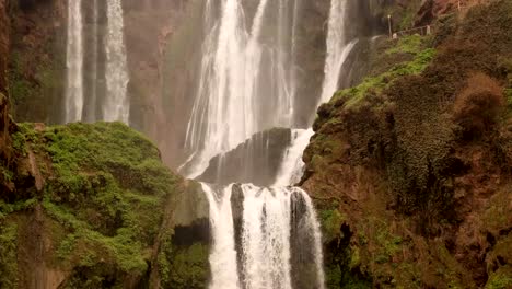 timelapse-pan-down-Ouzoud-Waterfalls-located-in-the-Grand-Atlas-village-of-Tanaghmeilt,-in-the-Azilal-province-in-Morocco,-Africa