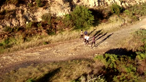 Cheerful-friends-running-outdoors