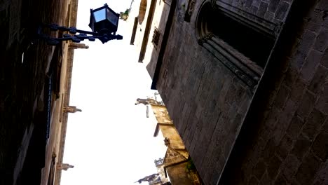 Low-angle-shot-of-a-catholic-cathedral-in-the-Gothic-quarter-of-Barcelona