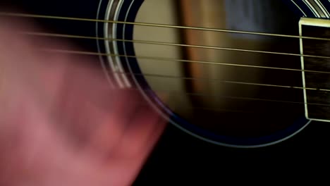 man-playing-Acoustic-guitar-close-up