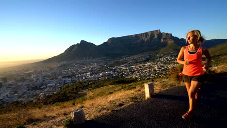 Young-woman-running-at-sunrise,-Cape-Town,-South-Africa