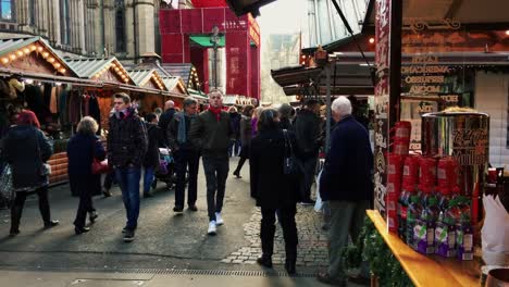 MANCHESTER,UK---DECEMBER-16,-2016.-Shot-of-shoppers-at-the-Christmas-market-in-front-of-the-Manchester-Town-Hall-on-Albert-Square.-December-16,-2016