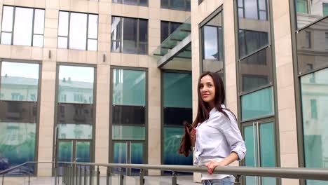 Long-haired-girl-standing-near-the-shopping-center