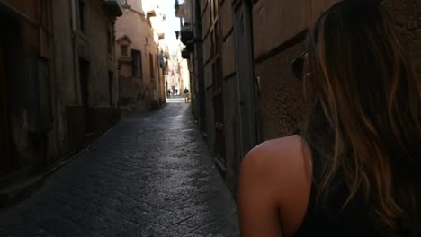 Young-Woman-Walking-and-Discovery-a-Small-Village-in-Italy