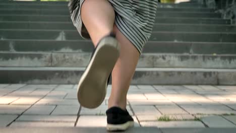 Silhouette-of-young-calm-muslim-girl-in-hijab-walks-up-stairs-in-park-in-daytime-in-summer,-religious-concept,-urban-concept