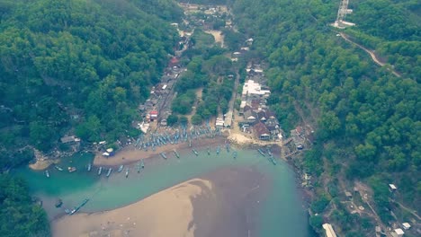 Baron-beach-traditional-fishing-boats-docked-to-the-shore-aerial-view,-Yogyakarta,-Indonesia