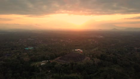 Borobudur-temple-aerial-view-at-sunrise-a-UNESCO-site-and-World-largest-Buddhist-temple,-Indonesia