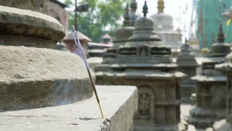 Incense-smoldering-in-ancient-Sawayambhunath-monkey-temple-in-Kathmandu,-Nepal.