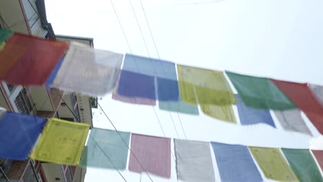 Traditional-colorful-buddhism-prayer-flags-over-over-street-in-Kathmandu,-Nepal