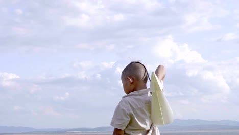 Asian-boy-with-brain-surgery-and-recovered-from-the-wound,-illness.-Return-to-normal-life.-Playing-with-a-paper-airplane.-Health-care-treatment-and-Life-Insurance-concept