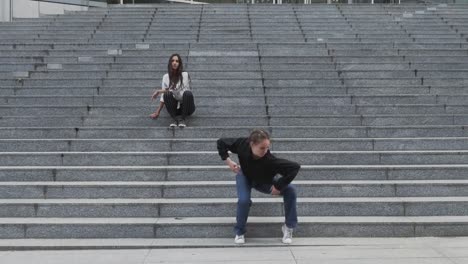 Girl-Sits-on-Steps-Another-Girl-Dances-on-Steps