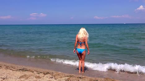 Beautiful-blonde-girl--against-the-sea,-Greece