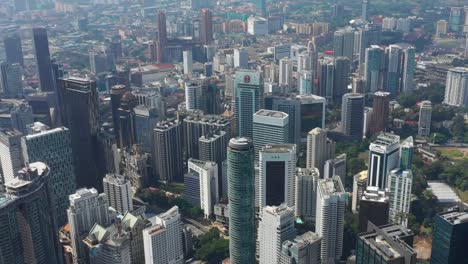 sunny-day-kuala-lumpur-city-downtown-famous-towers-tops-aerial-panorama-4k-malaysia