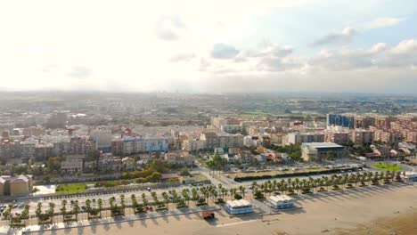 Aerial-view-over-the-beach-in-Valencia,-Spain.-Flight-drones-over-the-beach-in-Valencia.-View-of-the-tourist-city